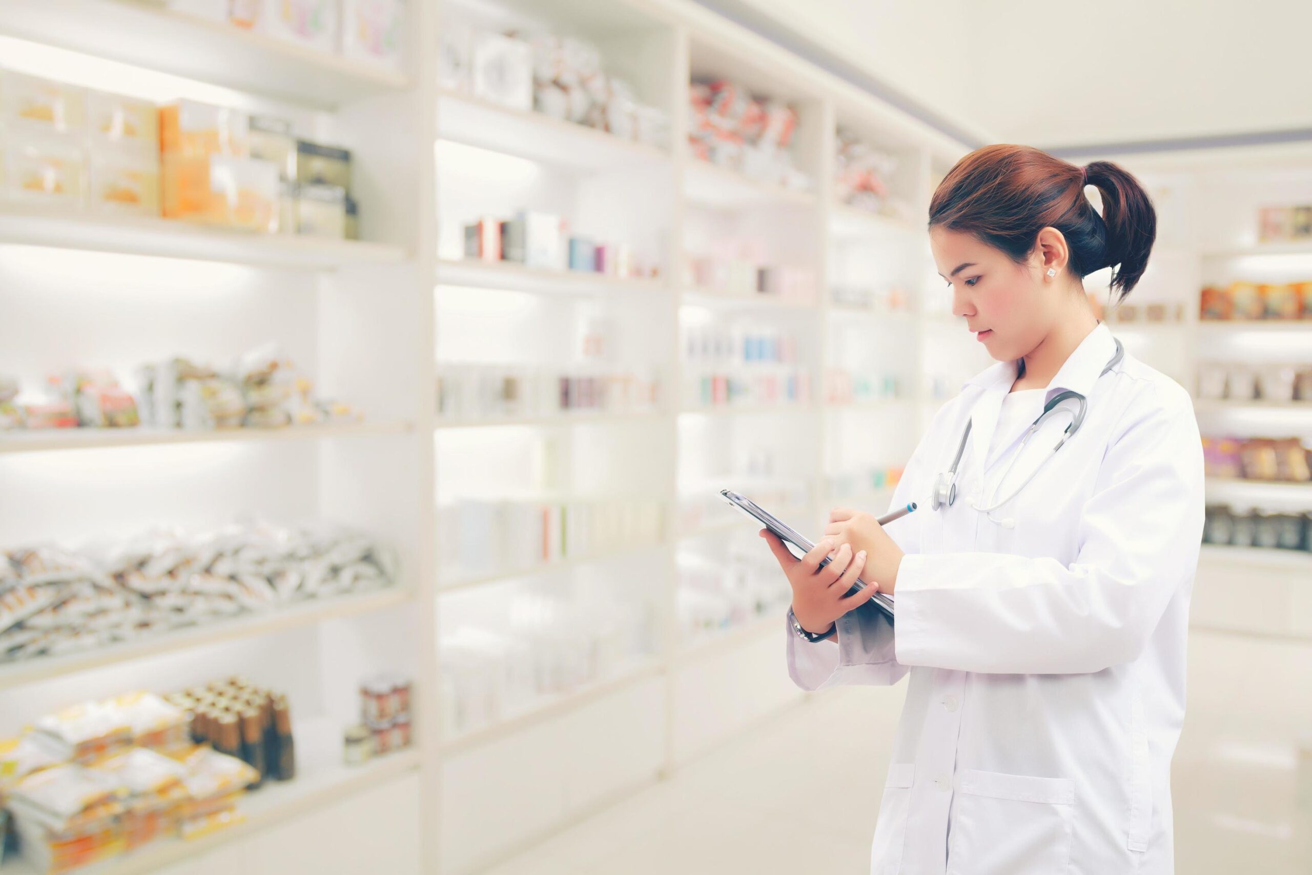 pharmacist-with-pharmacy-background-free-photo-scaled.jpg